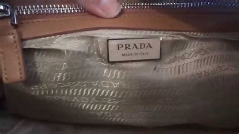 how can you tell if prada purse is real|prada purse serial number.